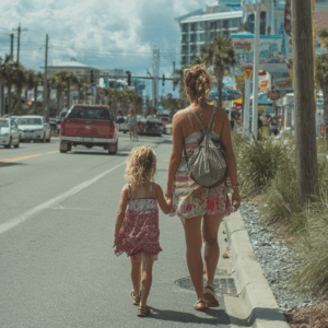 mother and daughter walking on a busy road in SC