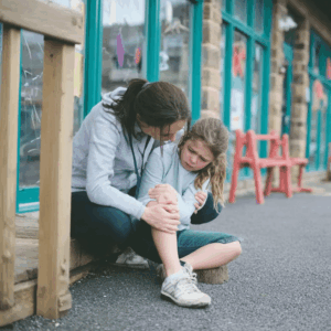 Woman consoling her daughter who slipped outside a shop in Myrtle Beach